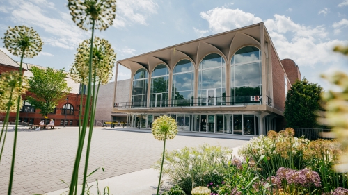 Hopkins Center facade with spring flowers in the foreground