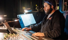 Dartmouth student at the soundboard during a theater performance