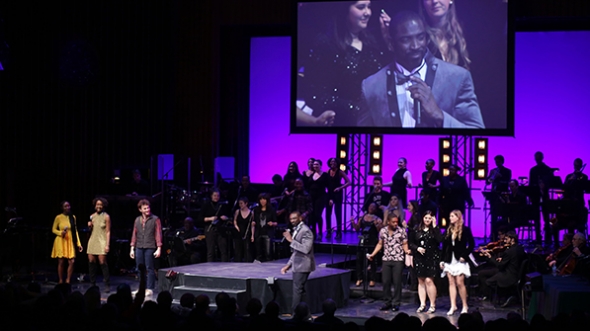 Walt Cunningham on stage with the Dartmouth Idol contestants